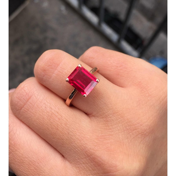 OCTAGONAL EMERALD CUT RING WITH RED STONE